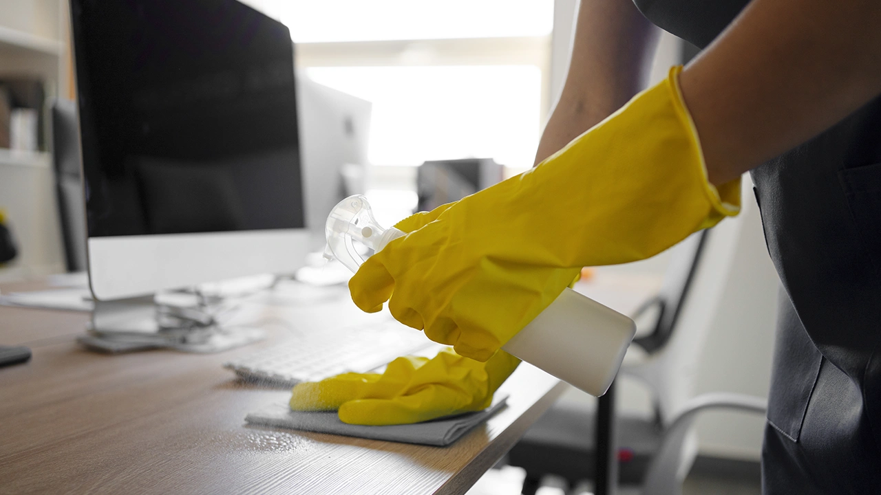 Office desk being sanitized during a commercial cleaning