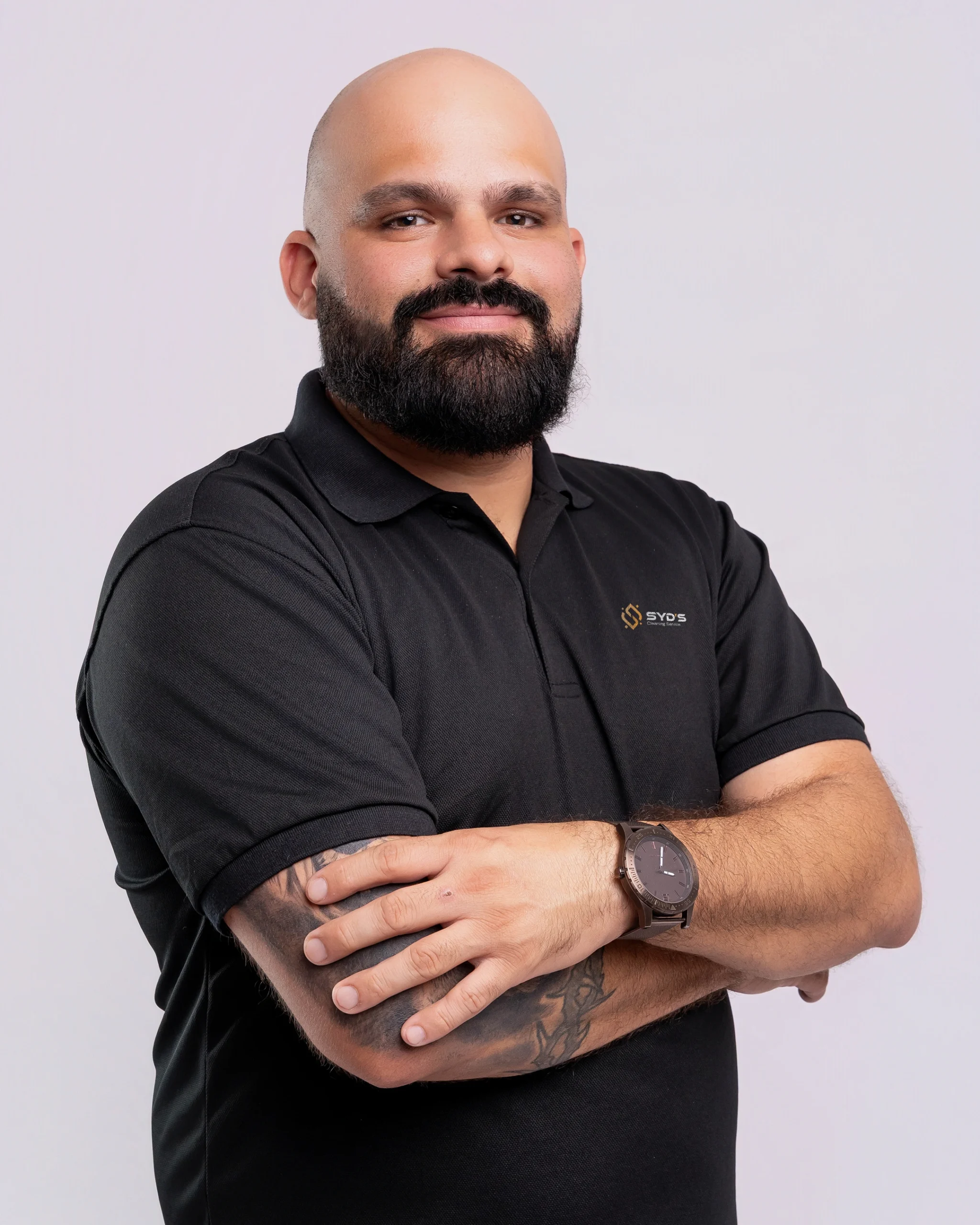 Syd's Cleaning Service professional in branded uniform