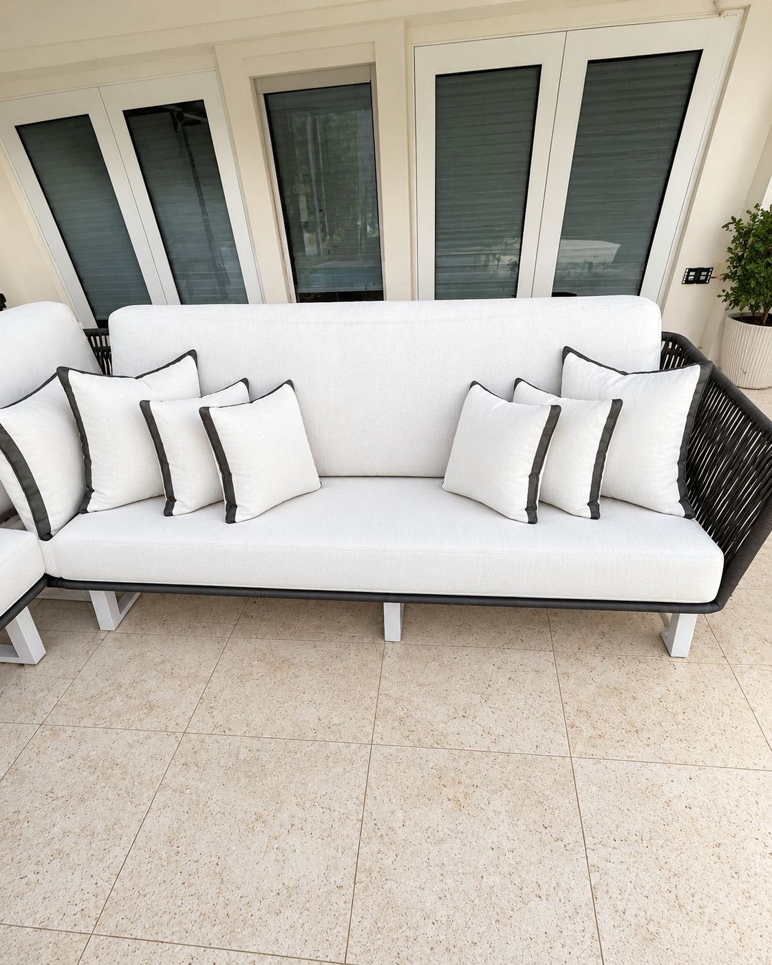 The same patio sofa fully assembled, clean, organized and refreshed